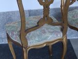 two chairs sitting next to each other on the floor