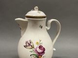 an image of a white coffee pot with flowers on it