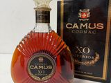 an image of a bottle of camus cognac next to a box