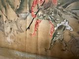 a painting of a man riding a horse with a sword
