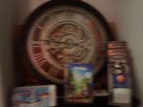 a clock that is sitting on a shelf in a room