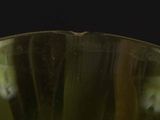 a close up of a glass vase with water in it