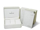 two boxes of white soap sitting next to each other on a white surface