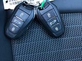 two car keys in the back seat of a car