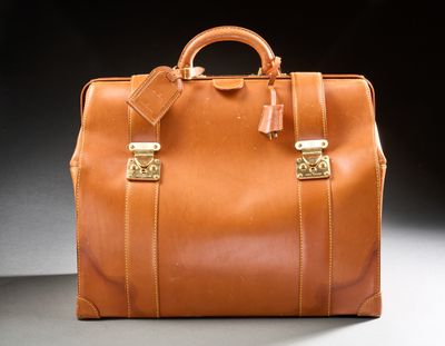 a brown leather bag sitting on a table