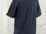 the back of a blue shirt on a mannequin mannequin mannequin mannequin mannequin mannequin mannequin mannequin