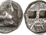 a close up of a coin with a face on it