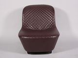 leather lounge chair with quilted seat and foot rest
