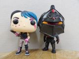 a couple of action figures standing next to each other on a table