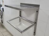 a sink in the middle of a tiled bathroom