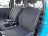 two seats in the back of a blue car