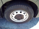 a close up of a tire on the side of a car