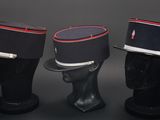 three hats are lined up on top of a mannequin head