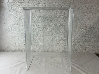 a glass picture frame on a table with a white background
