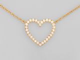 a diamond heart necklace on a gold chain