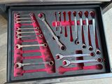 a box of wrenches and other tools in it