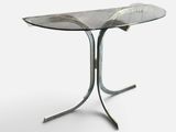 an image of a glass table with a metal base and a glass top