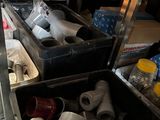 many different types of pipes and fittings in a store