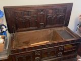 a large wooden bed with a wooden headboard and foot board