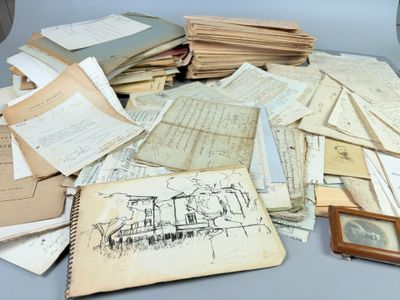 a pile of old papers sitting on a table