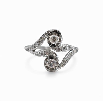 a close up of a diamond ring on a white background