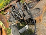 a close up view of a rusted out machine on the ground