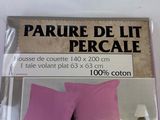 packaging of a pink bed with two pillows and a pillow case