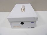 a white box that has a gold logo on it