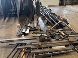 a pile of metal in a warehouse with lots of them