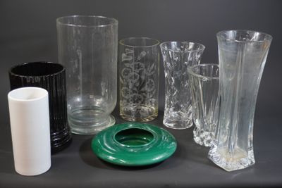 a lot of glass vases that are sitting on a table
