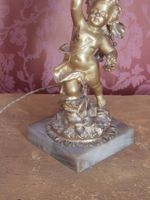 CANDELABRE en bronze ciselé et doré à décor d'un putti soute… (photo 5)
