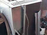 a microwave oven sitting on top of a pile of junk