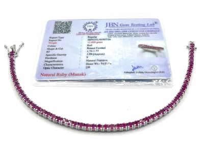 pink and silver beaded bracelet with a card attached to it