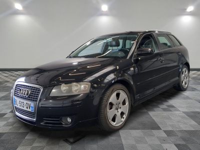 an image of a black audi wagon parked in a garage