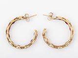 a pair of gold hoop earrings on a white background