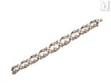 a close up of a diamond bracelet on a white background
