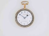 a close up of a gold and diamond watch on a white surface
