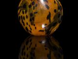 a glass bottle with a leopard print design on it