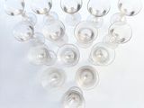 many wine glasses arranged in the shape of a heart