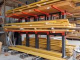 a large amount of wood in a warehouse with pallets