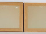 pair of wooden picture frames with glass inserts on white background