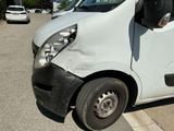 a white van that is parked in a parking lot
