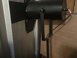 a black light that is on a stand in a room