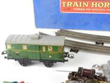 a toy train that is sitting next to other toy trains