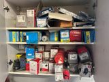 many boxes and boxes on the shelves in the closet