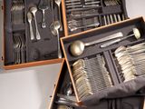 many different types of silverware in a box