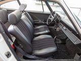 an image of a car with a dog sitting in the passenger seat