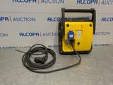a yellow and black portable air compressor sitting on top of a table