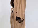 an image of a brown coat with a fur collar on a mannequin