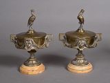 pair of antique brass vases with birds on them on marble bases